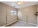 Small carpeted bedroom with a window and neutral walls at 6594 W Mississippi Way, Lakewood, CO 80232