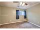 Carpeted bedroom with window and ceiling fan at 6594 W Mississippi Way, Lakewood, CO 80232