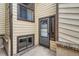 Exterior view of the back door entrance with windows and siding at 6594 W Mississippi Way, Lakewood, CO 80232