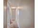 Neutral colored hallway with carpeted floors at 6594 W Mississippi Way, Lakewood, CO 80232