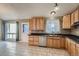 Kitchen features ample wood cabinets, stainless steel appliances, and tile floor at 6594 W Mississippi Way, Lakewood, CO 80232