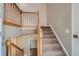 Wooden staircase leading to the upper level at 6594 W Mississippi Way, Lakewood, CO 80232