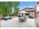 Backyard patio with ample seating, landscaping, and outdoor dining area for relaxation at 10694 E Dorado Ave, Englewood, CO 80111
