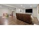 Finished basement featuring a living area, play area, and a large TV at 10694 E Dorado Ave, Englewood, CO 80111