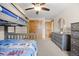 Charming bedroom featuring wood bunkbeds, dresser, and trimwork, with a ceiling fan at 10694 E Dorado Ave, Englewood, CO 80111
