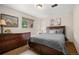 Cozy bedroom with wood flooring, a large window and classic wood furniture at 10694 E Dorado Ave, Englewood, CO 80111
