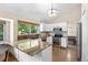 Bright kitchen featuring granite counters, stainless steel appliances, vaulted ceilings and a large window with natural light at 10694 E Dorado Ave, Englewood, CO 80111