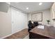 Office space featuring hardwood floors, desk, and storage, creating an optimal workspace at 10694 E Dorado Ave, Englewood, CO 80111