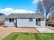 Fenced backyard featuring a patio, grass area, and gravel at 5280 E 128Th Way, Thornton, CO 80241