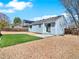 Backyard features small grass area and large gravel area with fence and patio at 5280 E 128Th Way, Thornton, CO 80241