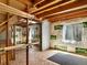 Unfinished basement with visible wood beams, concrete walls and windows wrapped with insulation at 5280 E 128Th Way, Thornton, CO 80241