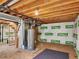 Unfinished basement with visible pipes, hot water heater, and walls wrapped with insulation at 5280 E 128Th Way, Thornton, CO 80241