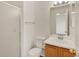 A well lit bathroom featuring a glass shower, toilet, and single sink vanity at 5280 E 128Th Way, Thornton, CO 80241