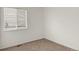 Well-lit bedroom featuring neutral carpet, white walls, and large window at 5280 E 128Th Way, Thornton, CO 80241