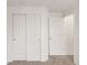 Hallway featuring carpet and white doors with gold hardware at 5280 E 128Th Way, Thornton, CO 80241