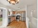 Bright kitchen features stainless steel appliances, light wood cabinets, and dark countertops at 5280 E 128Th Way, Thornton, CO 80241