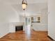 Bright living room featuring hardwood floors, vaulted ceilings, and a fireplace at 5280 E 128Th Way, Thornton, CO 80241