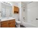 Bathroom featuring a tub and shower, a vanity, and wood-look flooring at 10535 Holyoke Dr, Parker, CO 80134