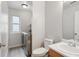 Bathroom with laundry space, toilet and sink at 10535 Holyoke Dr, Parker, CO 80134