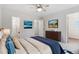 Light-filled bedroom with a dresser and walk-in closet access at 10535 Holyoke Dr, Parker, CO 80134