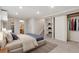 Bright bedroom featuring neutral tones, large closet, carpet and a doorway to the ensuite bathroom at 10535 Holyoke Dr, Parker, CO 80134