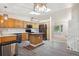 Modern kitchen featuring stainless steel appliances, a center island, and wood cabinets at 10535 Holyoke Dr, Parker, CO 80134