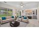 Bright living room with sliding glass doors and a view of the backyard at 10535 Holyoke Dr, Parker, CO 80134