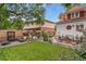 Spacious backyard featuring a lush lawn, outdoor seating, and decorative landscaping, perfect for enjoying the outdoors at 3016 N Franklin St, Denver, CO 80205