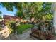 Backyard featuring a manicured lawn, decorative accents, patio area, and lush landscaping at 3016 N Franklin St, Denver, CO 80205