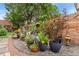 Landscaped backyard featuring various plants and decorative garden art, creating a whimsical outdoor retreat at 3016 N Franklin St, Denver, CO 80205