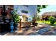 Charming backyard bench surrounded by lush plantings and decorative items at 3016 N Franklin St, Denver, CO 80205