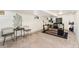Spacious basement featuring a work area, lounge seating, and decorative wall art, all illuminated with natural light at 3016 N Franklin St, Denver, CO 80205