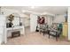 Finished basement with a cozy seating area, television, decorative accents, and access to other spaces at 3016 N Franklin St, Denver, CO 80205