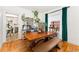 Dining room featuring a large wooden table, hardwood floors and stylish decor at 3016 N Franklin St, Denver, CO 80205