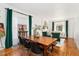 Dining room featuring a large wooden table, hardwood floors and stylish decor at 3016 N Franklin St, Denver, CO 80205
