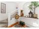 Bright foyer with staircase, hardwood floors and decorative accents at 3016 N Franklin St, Denver, CO 80205