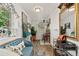 Bright and airy living area featuring natural light, comfortable seating, and unique decor at 3016 N Franklin St, Denver, CO 80205