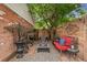Serene patio with a cozy fire pit and comfortable seating, surrounded by lush plants and decorative elements at 3016 N Franklin St, Denver, CO 80205