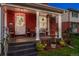 Inviting front porch features classic columns and comfortable seating at 3016 N Franklin St, Denver, CO 80205