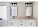 Elegant bathroom featuring a double sink vanity with marble countertops and modern black-framed mirrors at 1280 Galactic Pl, Castle Rock, CO 80108