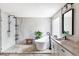 Modern bathroom featuring a freestanding tub, glass shower, and stylish vanity with stone countertops at 1280 Galactic Pl, Castle Rock, CO 80108