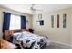 Bedroom featuring a bed with a dark wood frame and sports themed decor on the walls at 1280 Galactic Pl, Castle Rock, CO 80108