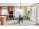 Breakfast nook with circular table, sliding doors and modern ceiling light fixture at 1280 Galactic Pl, Castle Rock, CO 80108