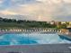 Inviting community pool with lounge chairs and an astonishing rainbow, ideal for relaxation and recreation at 1280 Galactic Pl, Castle Rock, CO 80108
