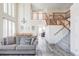Open concept living space with staircase, dining area, and views into other rooms at 1280 Galactic Pl, Castle Rock, CO 80108