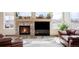 Inviting living room with a stone fireplace and large windows providing natural light and neighborhood views at 1280 Galactic Pl, Castle Rock, CO 80108
