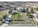 Stunning aerial view of a large home with lush landscaping and a long driveway at 1289 Diamond Ridge Cir, Castle Rock, CO 80108
