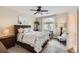 Cozy bedroom features a ceiling fan, a full bed with a window desk, and a soft carpet at 1289 Diamond Ridge Cir, Castle Rock, CO 80108
