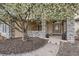 Home entrance with stone accents and a beautiful tree for shade at 1289 Diamond Ridge Cir, Castle Rock, CO 80108