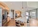 Spacious kitchen with a large island, stainless steel appliances, and hardwood floors at 1289 Diamond Ridge Cir, Castle Rock, CO 80108